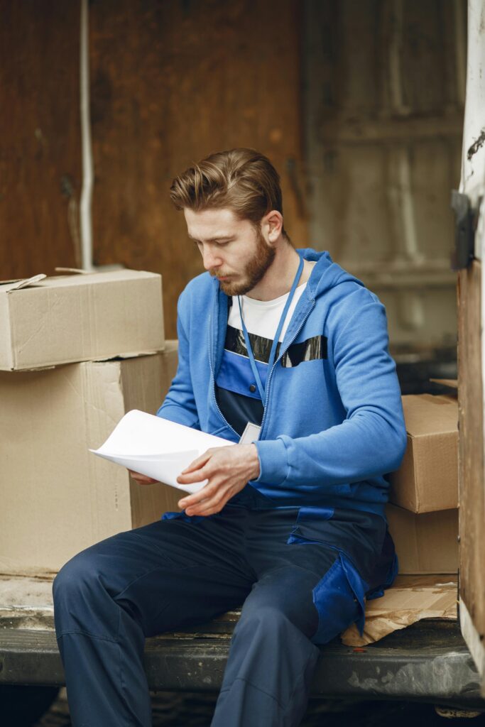 Delivery Worker Holding Invoices